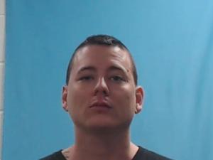 Warrant photo of Justin Bernard Aquino